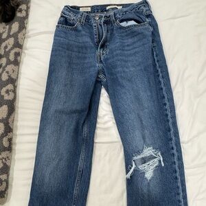 Levi’s 80s Ripped High Wasted Mom Jeans (medium indigo).
